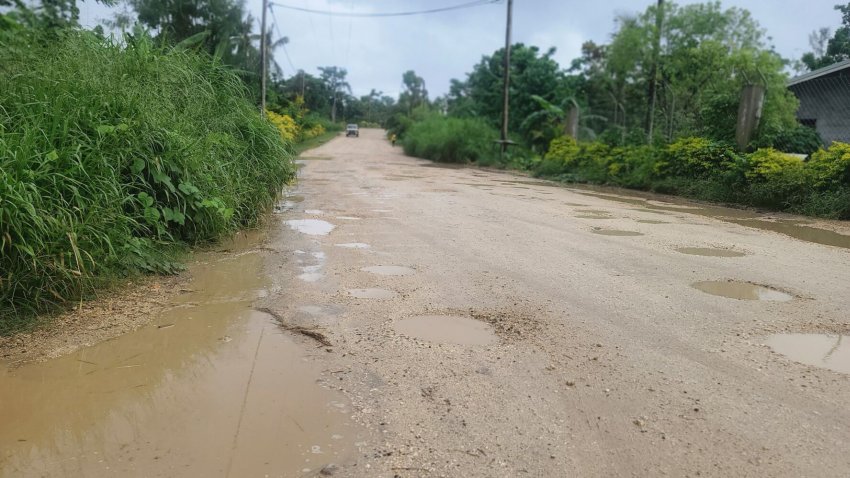dirt road in tropics with potholes