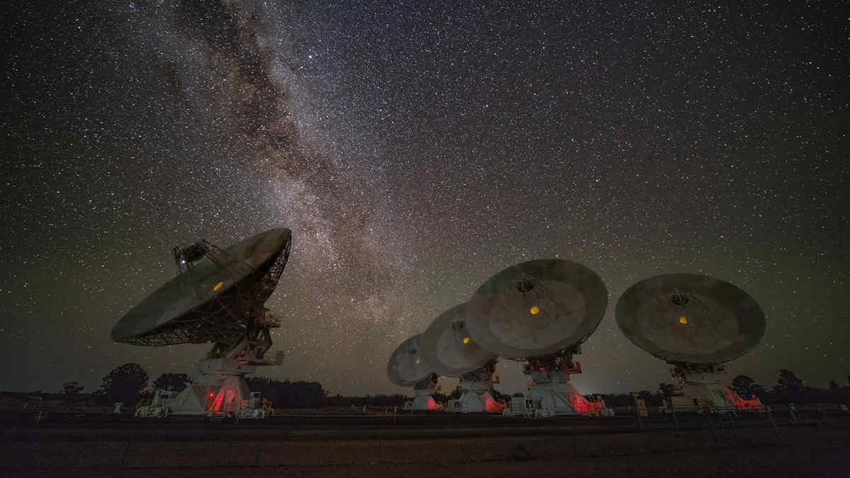 telescope dishes under stars milky way night sky