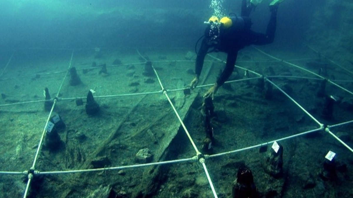 underwater excavation of boat in italy archaeology scuba diver