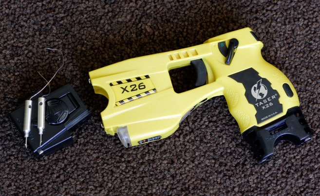 090216 taser 2. The Taser International X26 taser gun with cartridge and .....