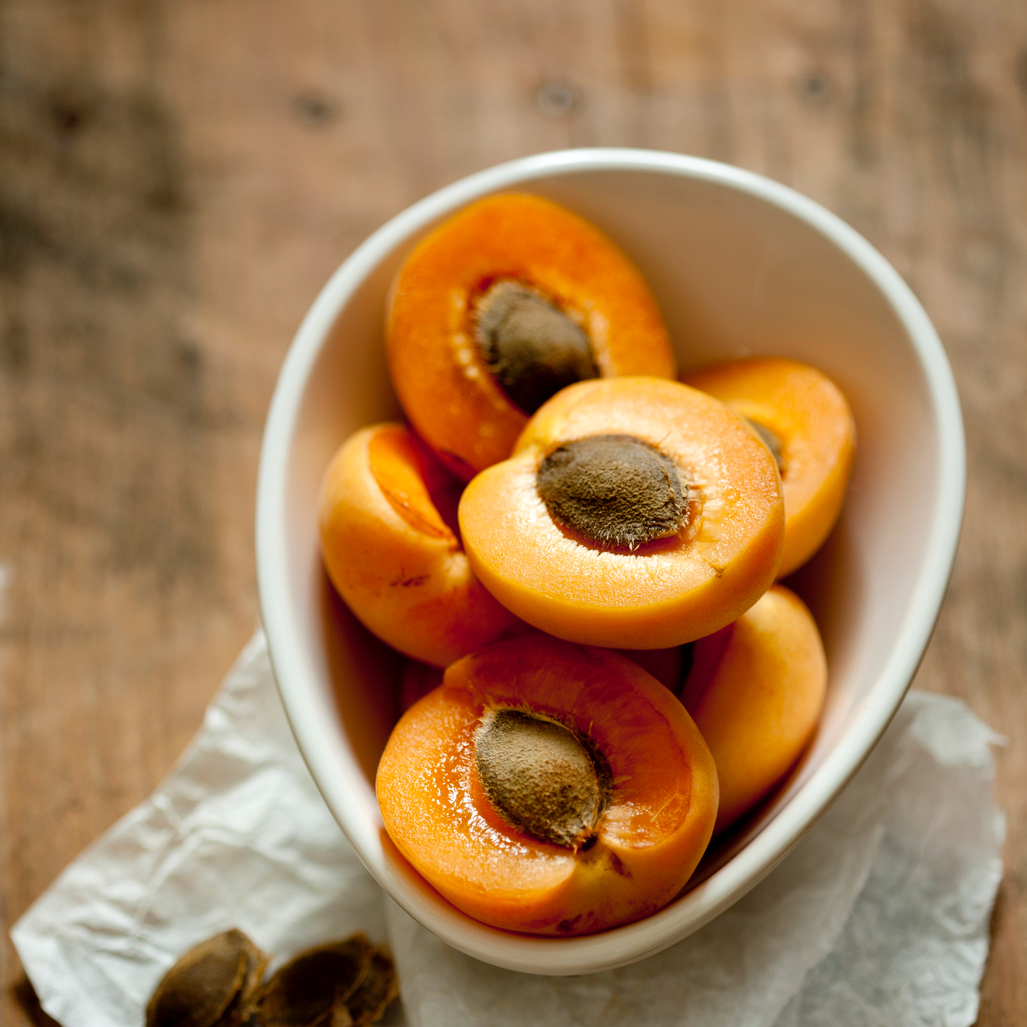 A bowl of halved apricots.