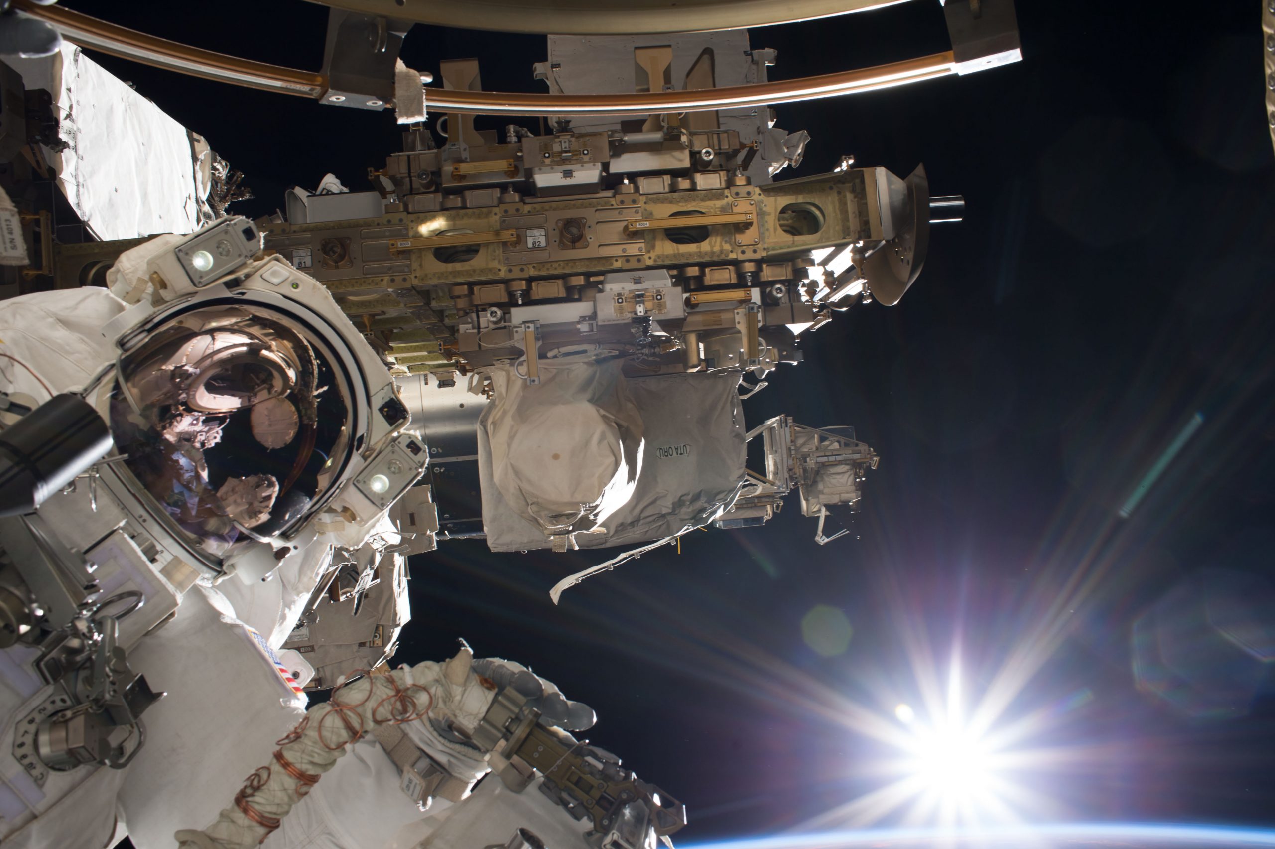 Astronaut mark vande hei outside the international space station.