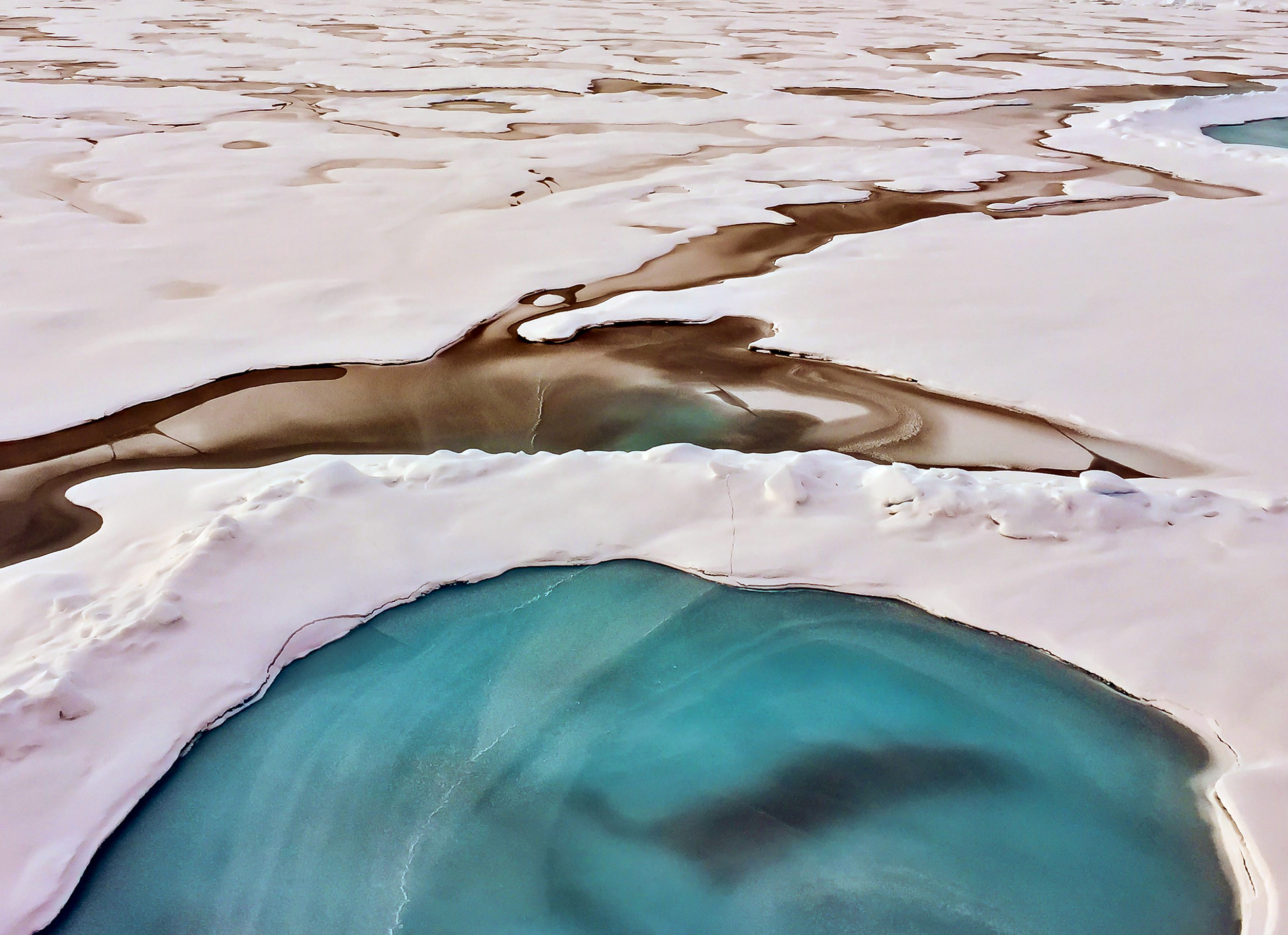 A frozen melt pond and sea ice seascape at 86°04'n, 168°21'e on august 30, 2015.