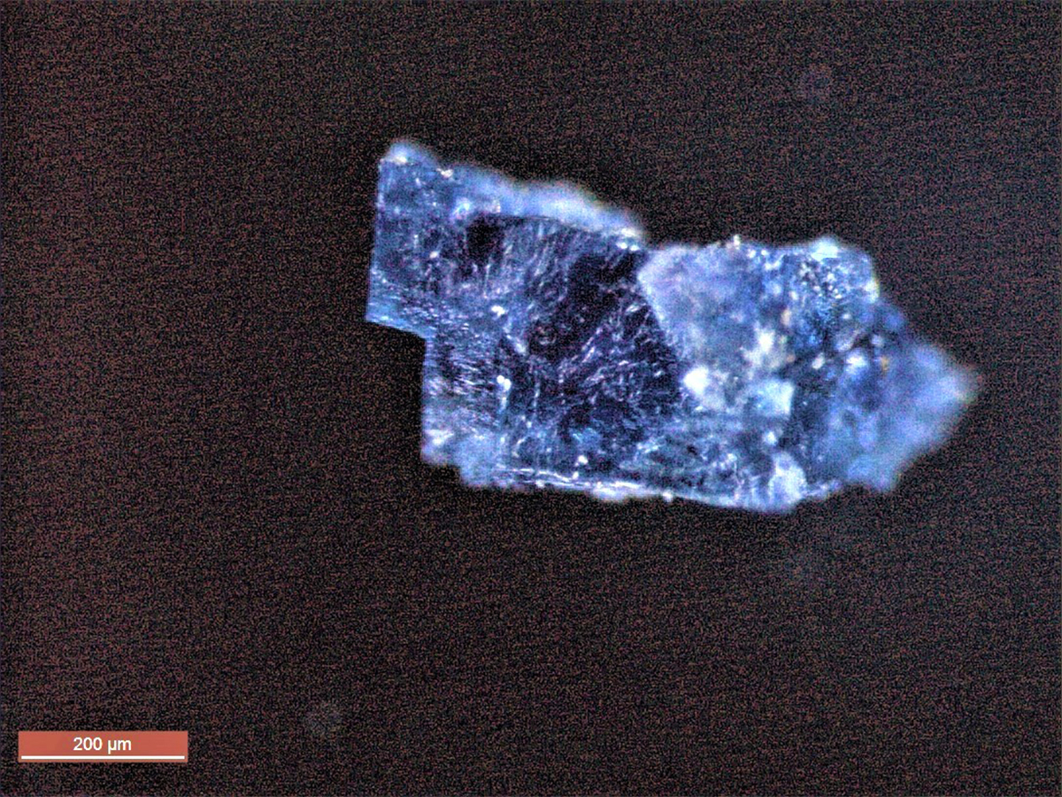 A blue halite (salt-based) crystal from the zag meteorite, which landed near morocco in 1998. The crystal contains a range of organic molecules including hydrocarbons and amino acids.