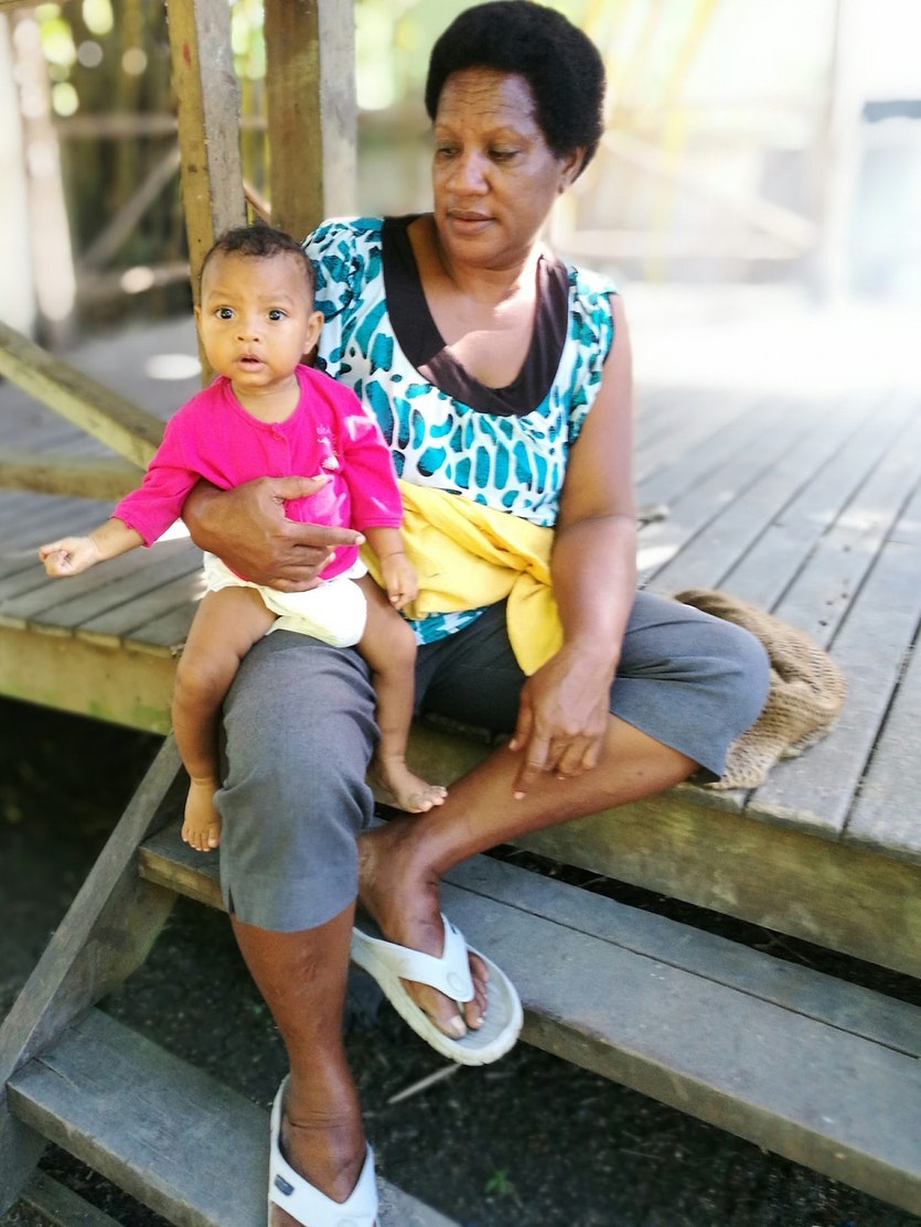 A mother and child in port morseby, papua new guinea.