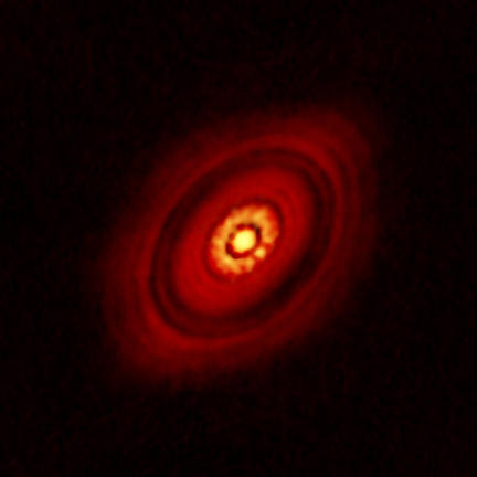 Young star caught cooking up planets
