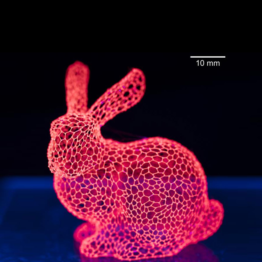 A 3D printed bunny made of isomalt sugar mixed with a glowing red dye used in biomedical imaging.