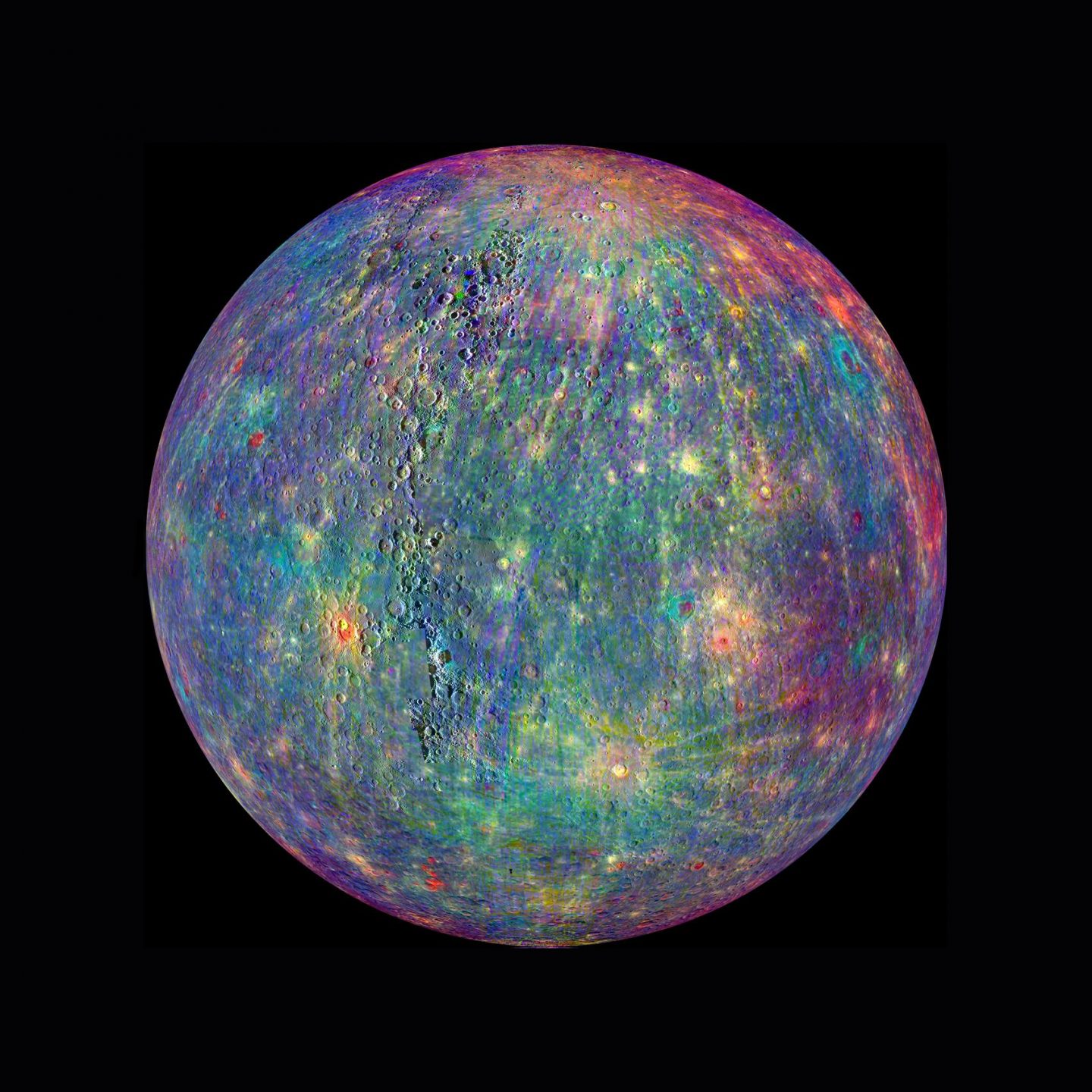 Different minerals appear in a rainbow of colors in this image of Mercury from NASA’s MESSENGER spacecraft.