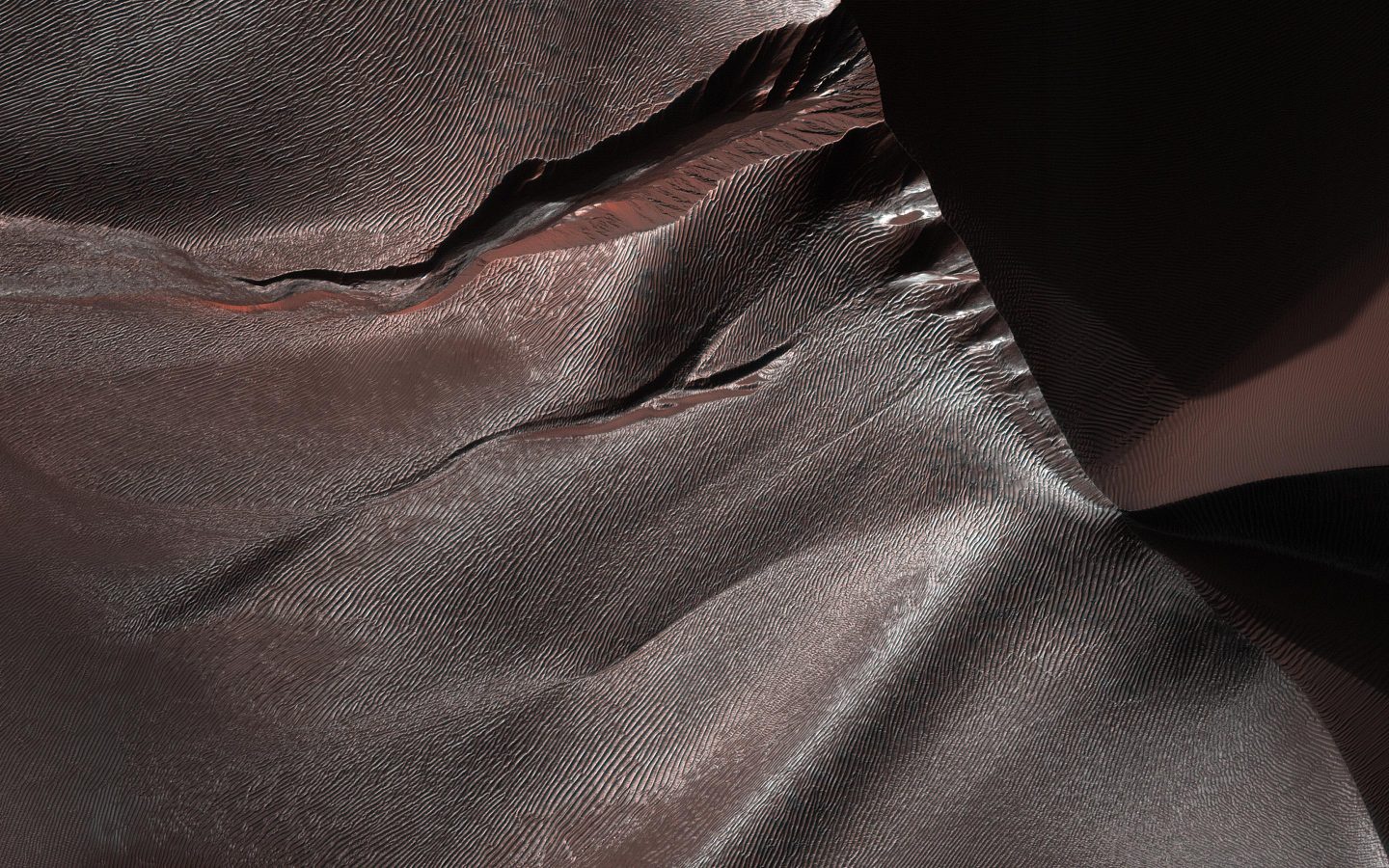 Lightly frosted gullies in sand dunes around Matara Crater on Mars.