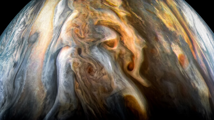 A JunoCam image of Jupiter's southern equatorial region oriented so the planet’s poles (not visible) run left to right.
