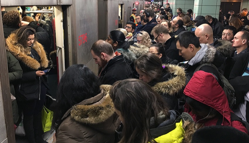 Commuters jam a Toronto subway platform. Widespread adoption of habits that help prevent infection may boost behavioural herd immunity.