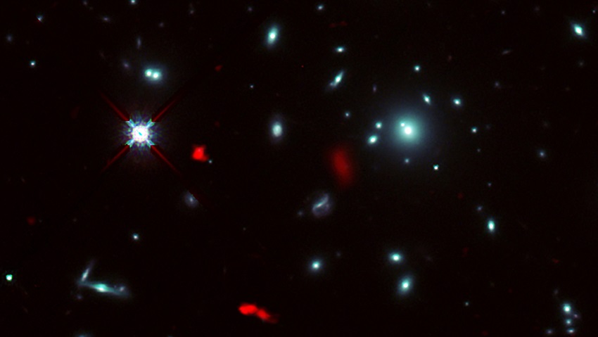 A galaxy cluster imaged by the Hubble Space Telescope.
