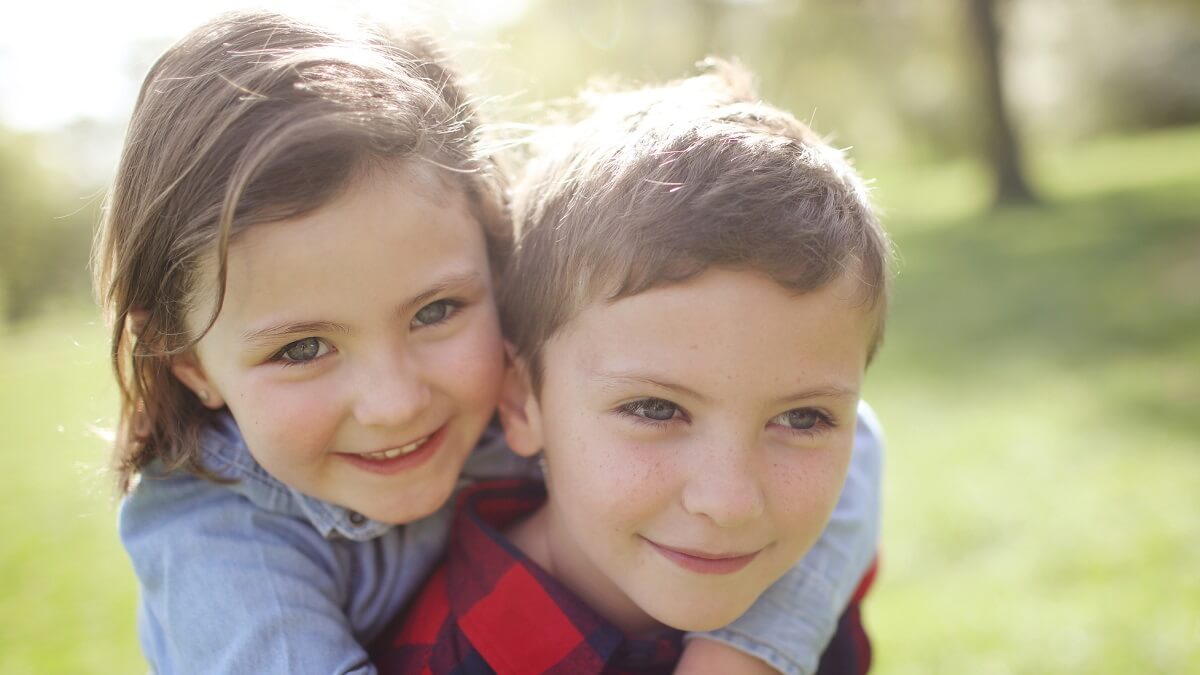 A brother and sister. New research has examined the genetic basis of the similarity between siblings' faces.