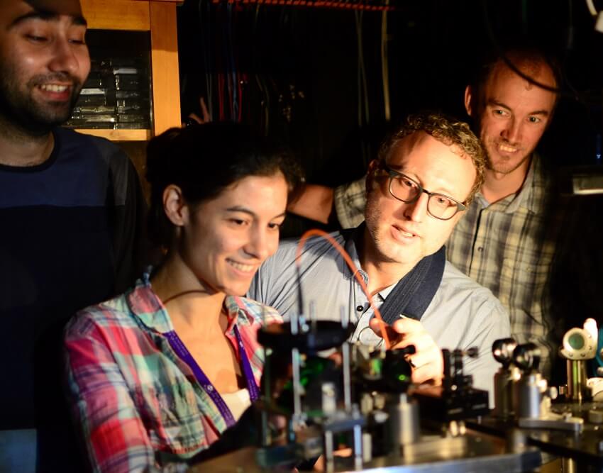 Uq team researchers (counter-clockwise from bottom-left) caxtere casacio, warwick bowen, lars madsen and waleed muhammad aligning the quantum microscope.