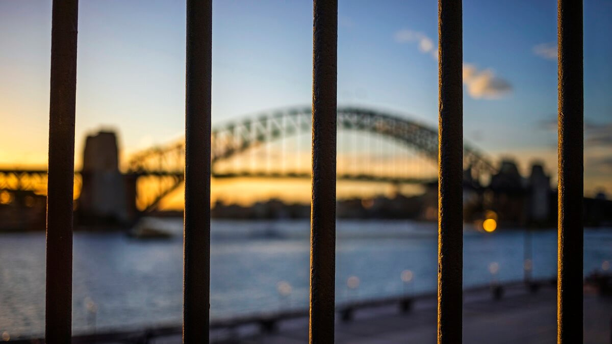 A picture of bars in front of the harbour bridge.