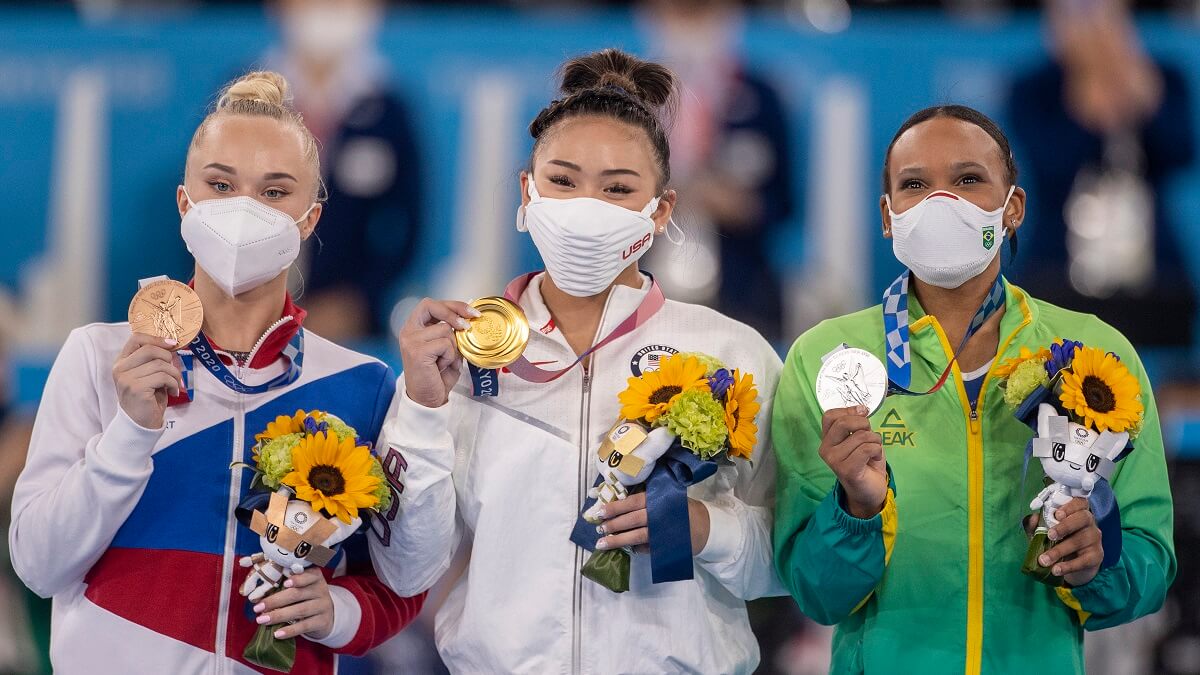 Photo of the gold, silver, and bronze medallists of the all-around female gymnastics at the Tokyo Olympics, each displaying their medals