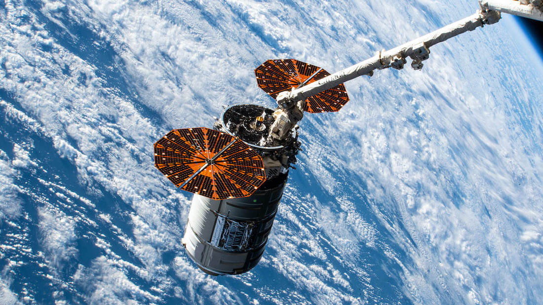 Cygnus spacecraft and ISS robotic arm