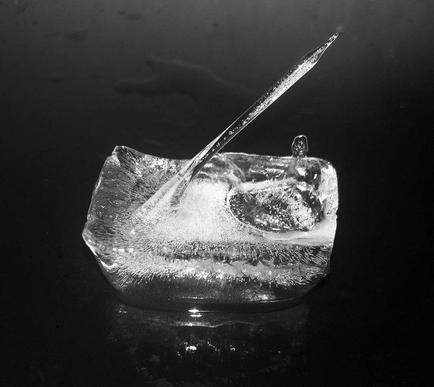 Ice cube with spike of ice coming out of it