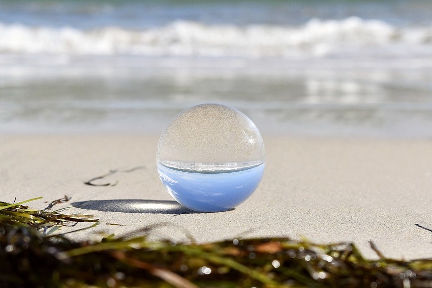 Crystal ball on a beach