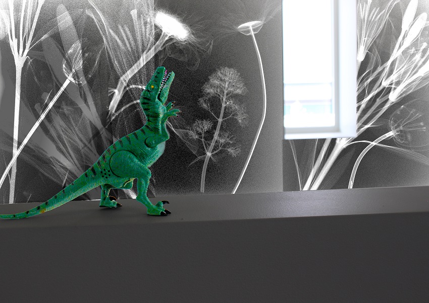 Photo of a plastic dinosaur superimposed on x-rays of flowers