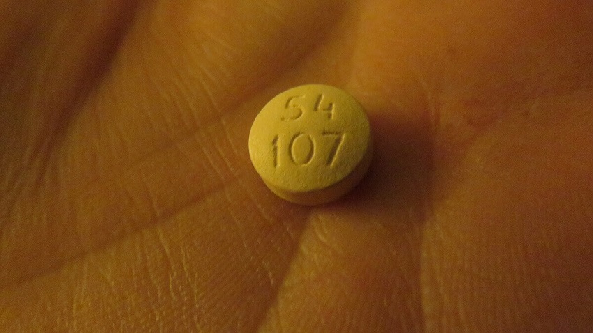 Lithium pill in a person's hand