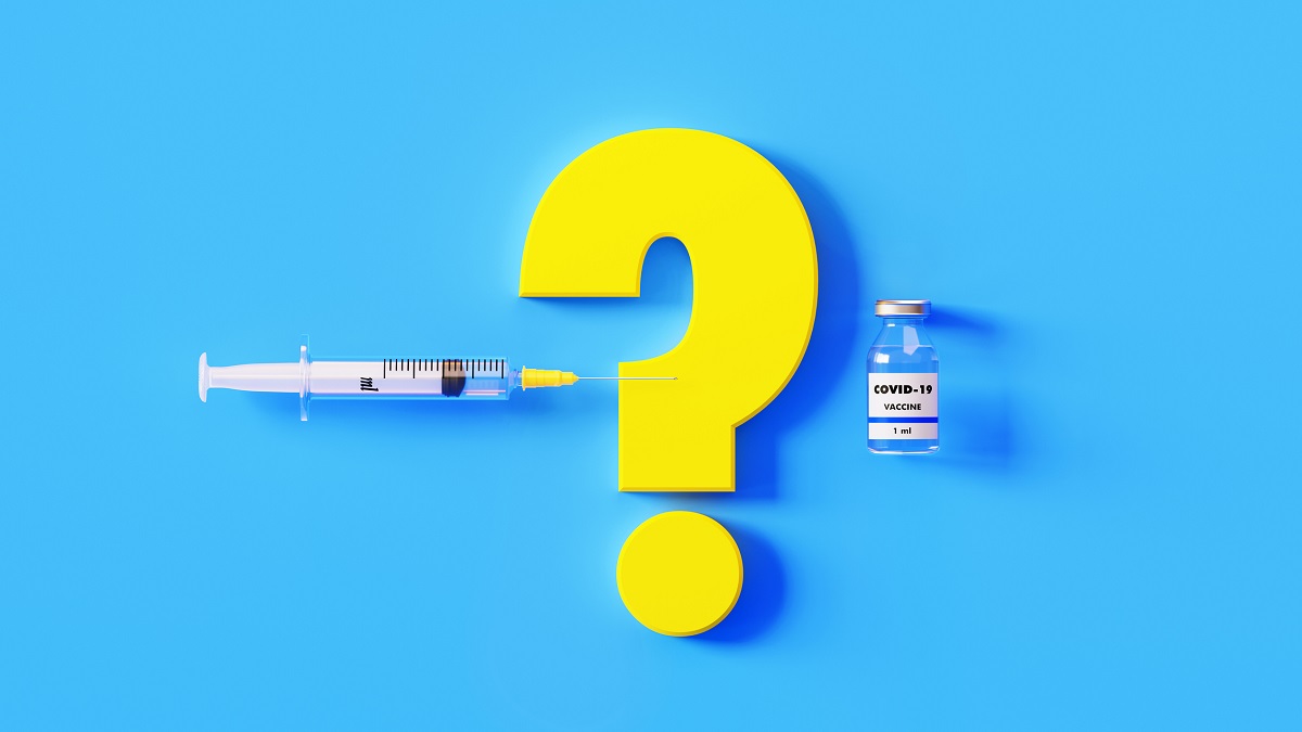 COVID-19 vaccine bottle, yellow question mark and syringe on blue background