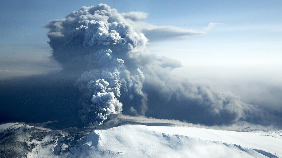 Volcano erupting over ice