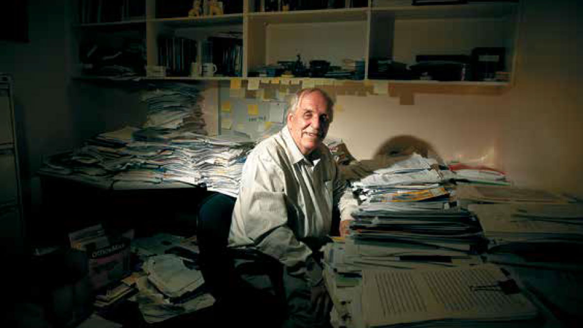 Roger Short in chaotic office.