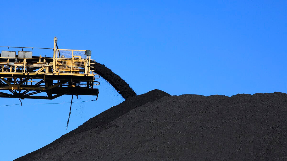 coal conveyor belt pumping onto a pile of coal