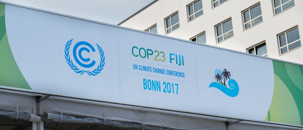 Sign reading 'cop23 fiji, un climate change conferece, bonn 2017' on a building