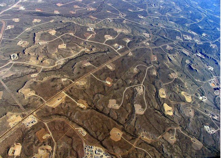 Aerial shot of fracking fields showing roads linking together