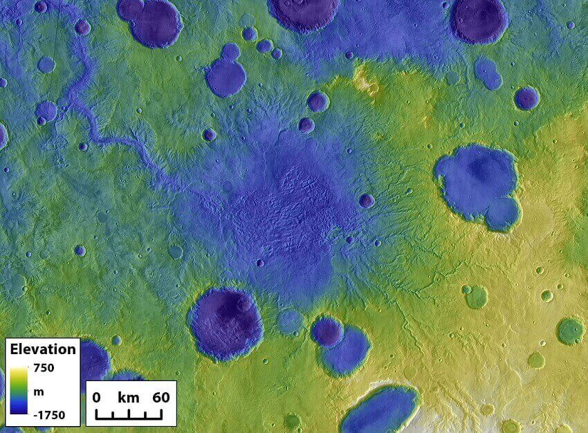 A false colour aerial image of craters and river valleys on mars