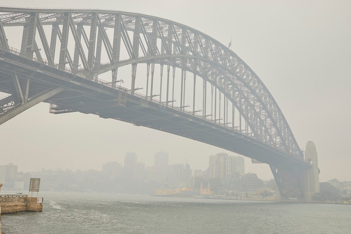 Sydney harbour bridge in smoke haze