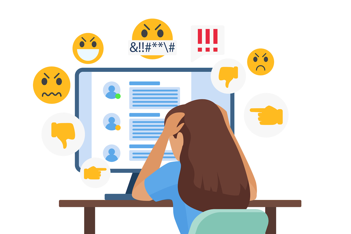 Illustration of sad young bullied woman character sitting in front of computer with online dislike in social media