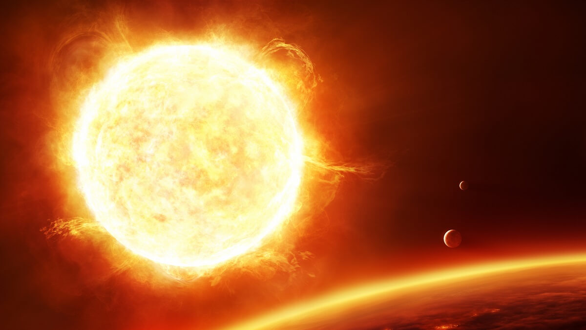 Illustration of a big fiery red sun with planets and moons in the foreground.