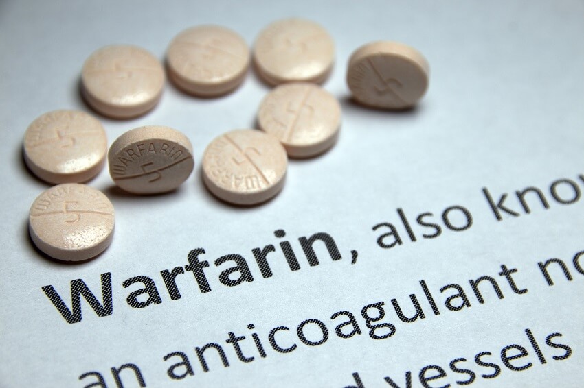 Warfarin pills on a piece of paper
