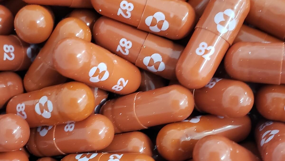 A pile of brown pills. They have the number 82 written on them