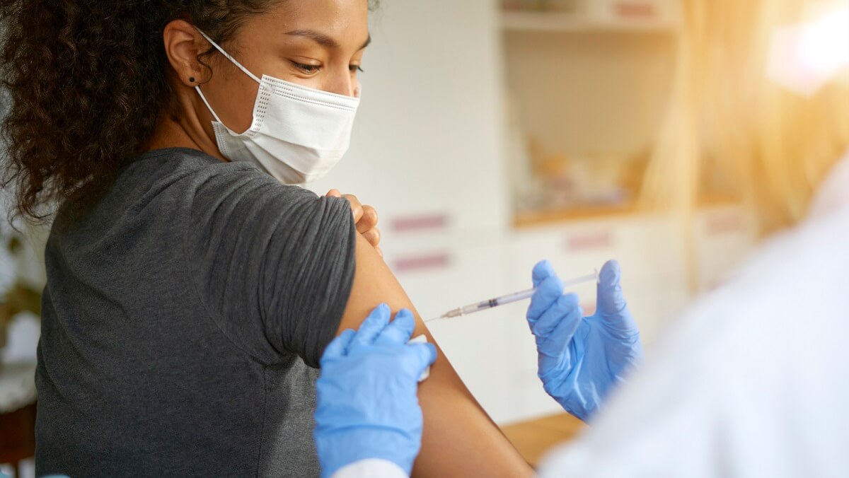 A woman getting a vaccine injection