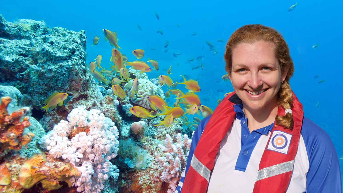 carly randall in front of a coral reef