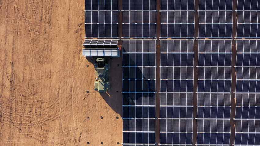 Aerial view of a solar panel array in the desert