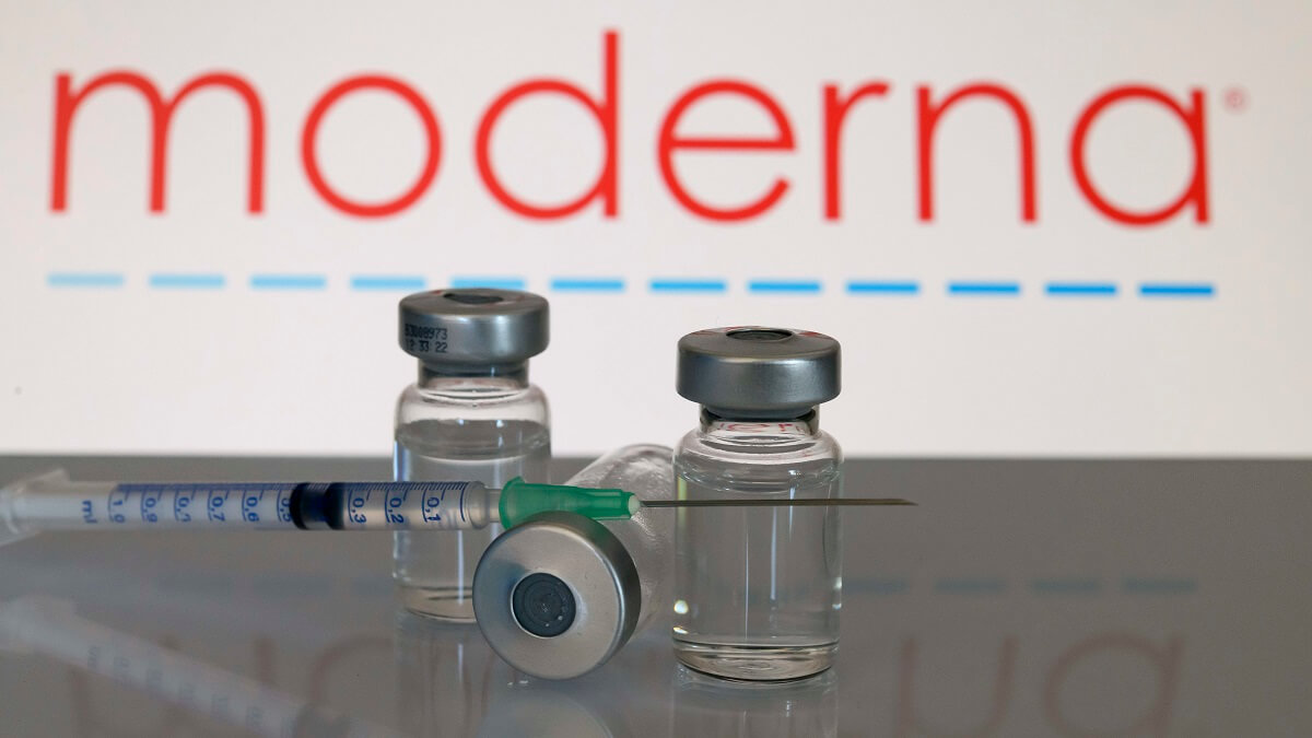 vaccines in front of the moderna logo