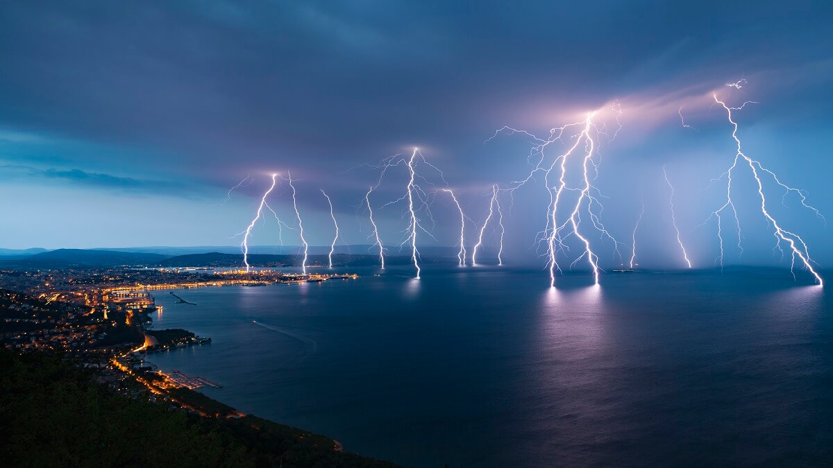 Lightning striking over the ocean