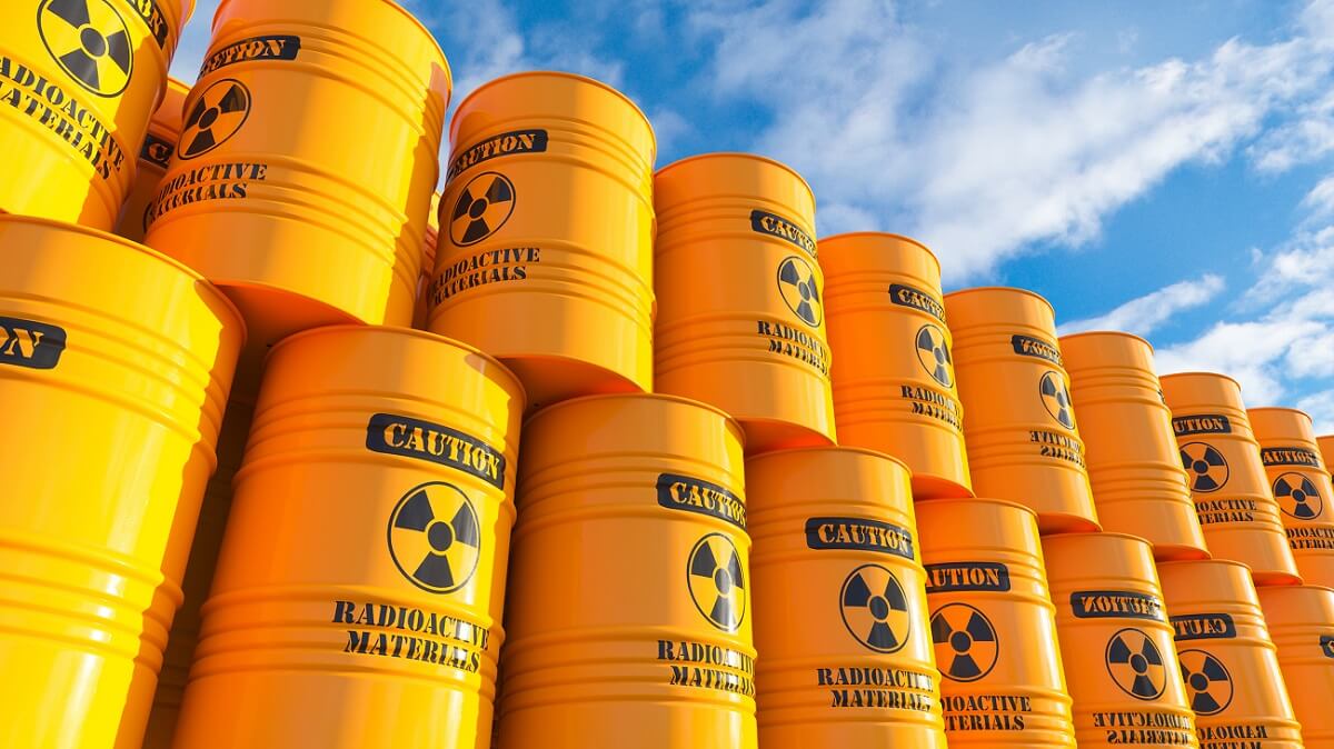 Storage of yellow barrels with nuclear waste on outdoor sky