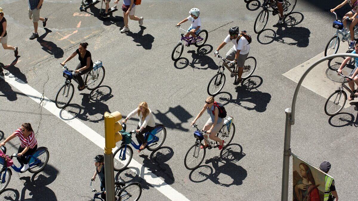 people cycling on a street