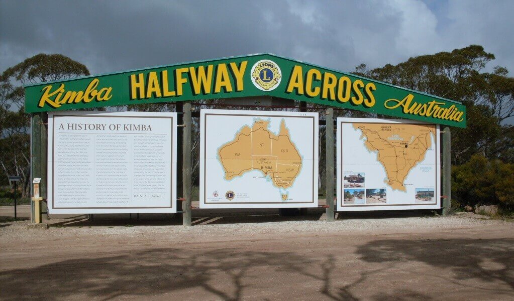 A sign featured in the south australian town of kimba, marking halfway across australia