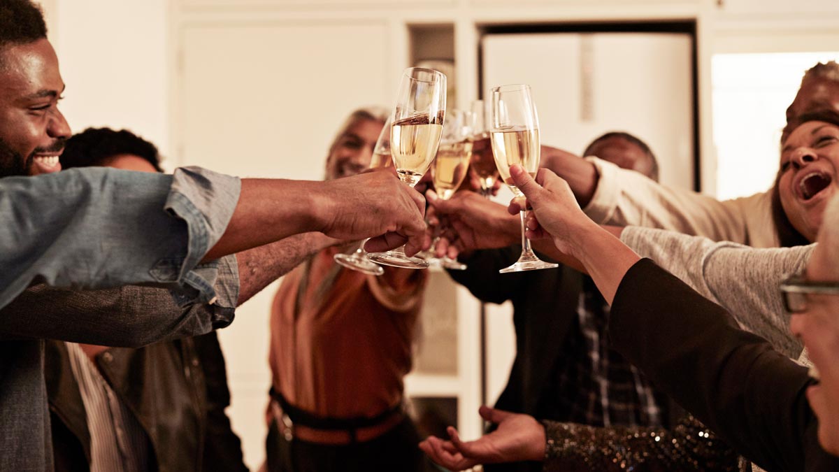 group of people toasting with sparkling wine