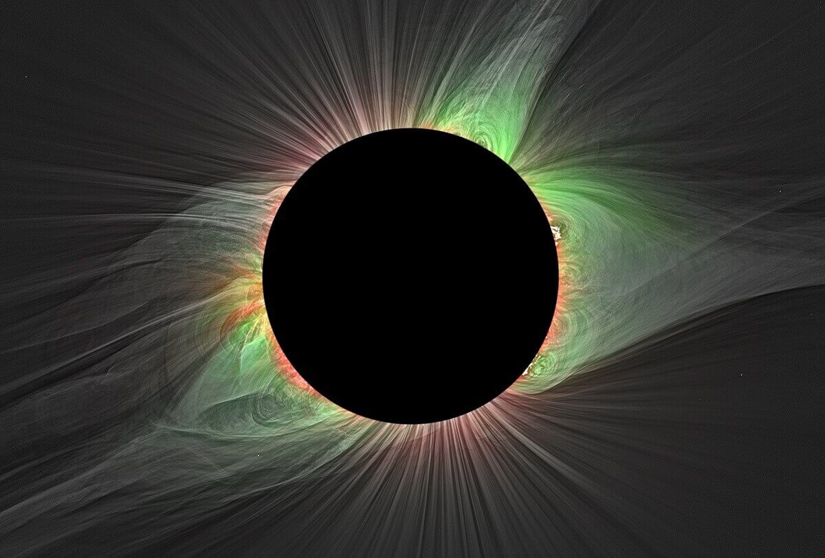 Image of black circle (moon in front of sun) and coloured loops and streamers emerging from behind the circle, showing the sun's corona