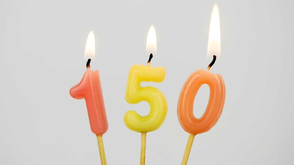 Lit candles mark a 150th birthday.