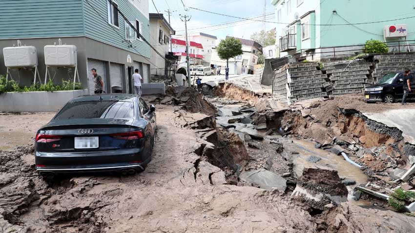 Earthquake damaged street car and buildings