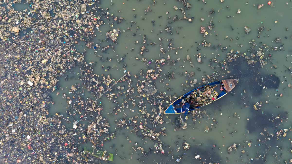 aerial shot showing ocean microplastic and plastic pollution in indonesia